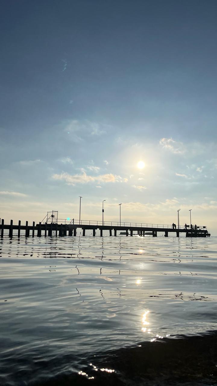 Dock view at Black Rock, [travel album] Madeline Djaja, digital file, 2024